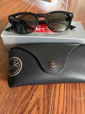 Ray-Ban Black Frame Sunglasses with Green-Tinted Lenses